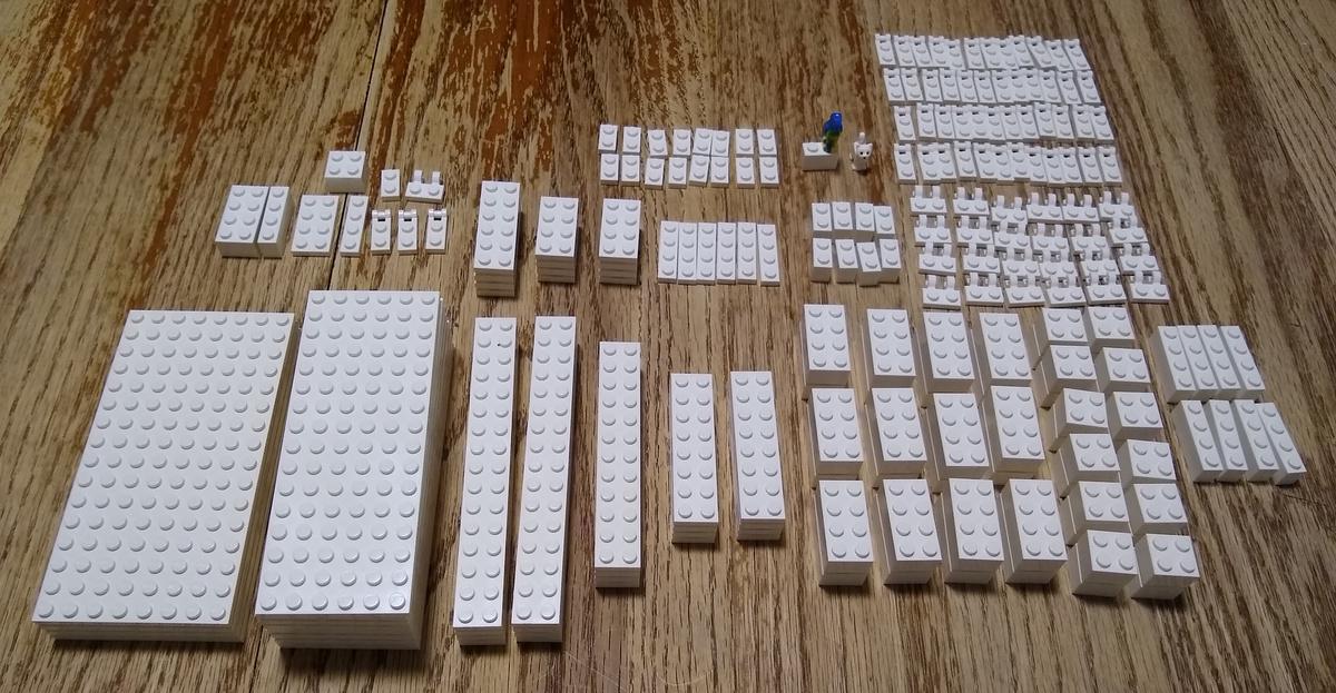 All of the LEGOs I bought, laid out on the table. It's a lot -- over 200 pieces. They're all white.