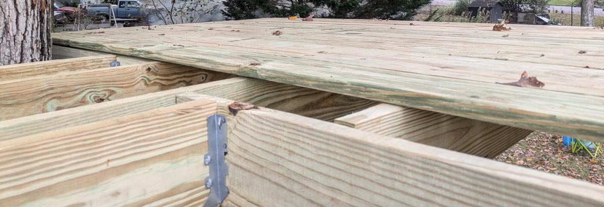 A close-up view of the right half of the decking from just above the trap door opening.